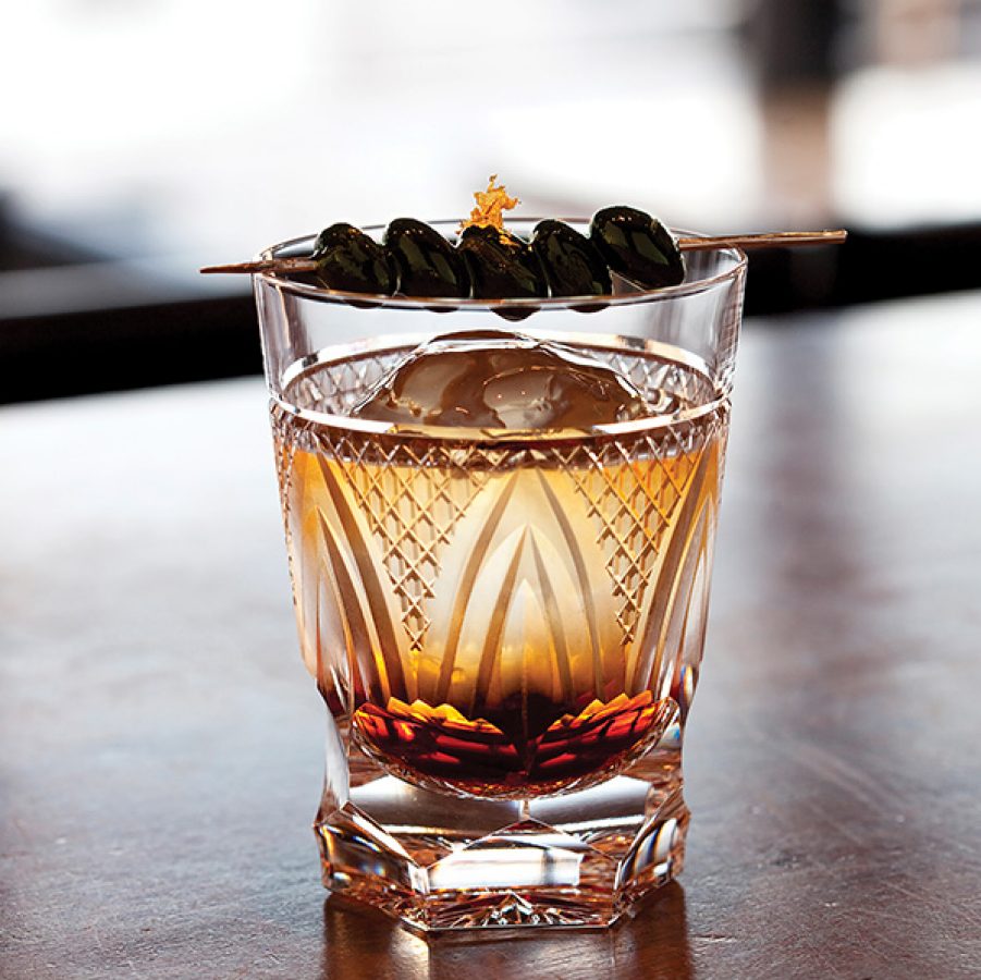 A drink with a garnish on top at Bar Oscar in Fukuoka.