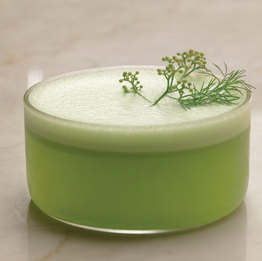 A green drink with a garnish as served at Ku Bar in Bangkok.