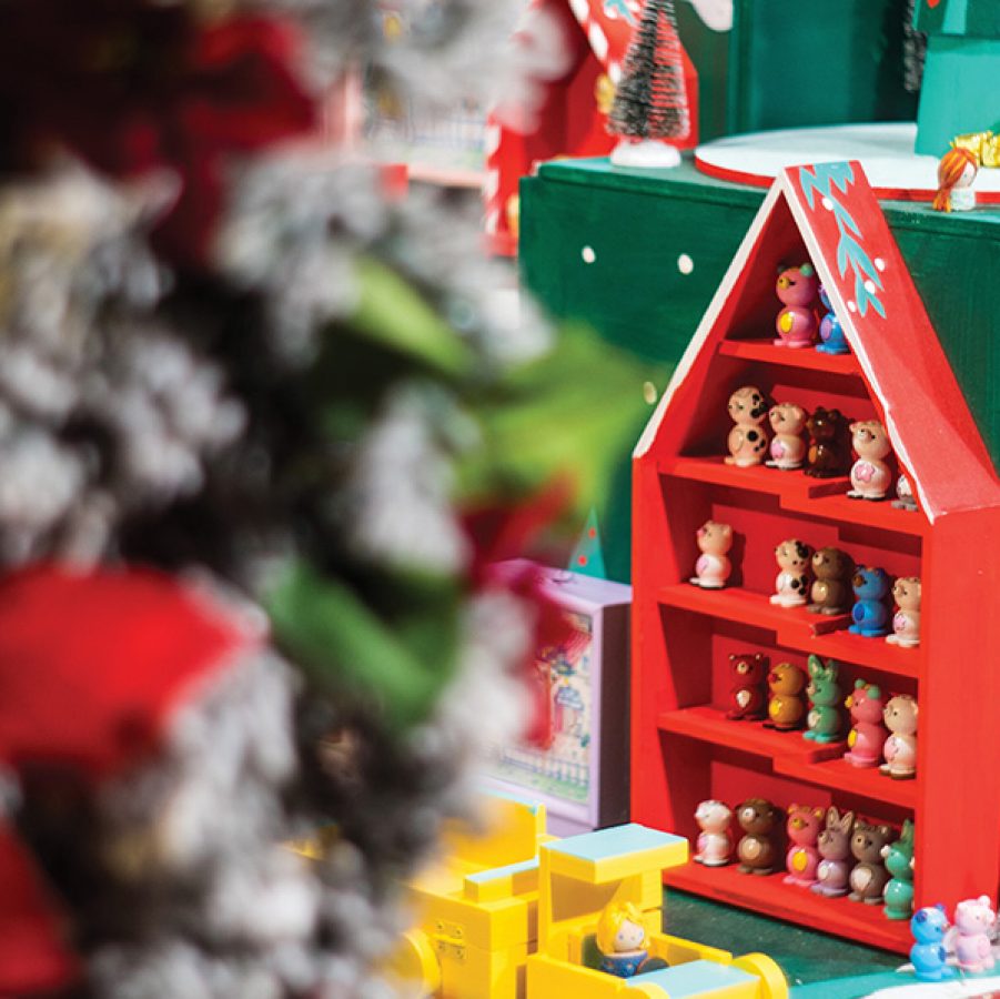 A photo of Christmas decorations, toys and figurines for children.