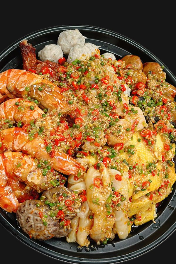 Poon choi, a traditional Cantonese dish, made by Silas Li with a Sichuan-inspired twist for his family to eat during Christmas.