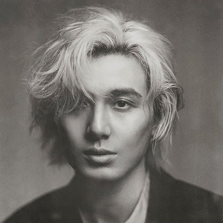A black, white and grey photo of Japanese singer Fujii Kaze.