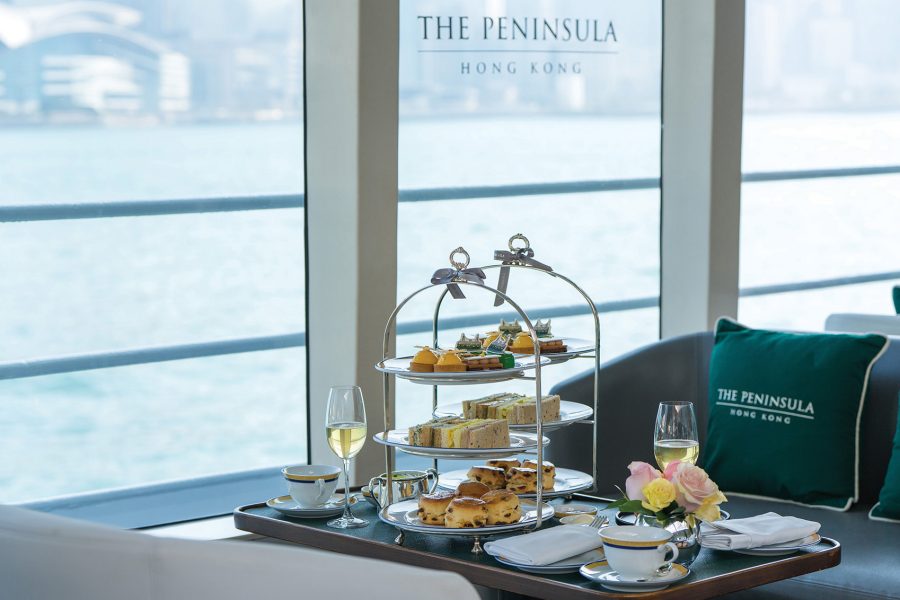 The Peninsula high tea set and a view of Victoria Harbour from the lounge.