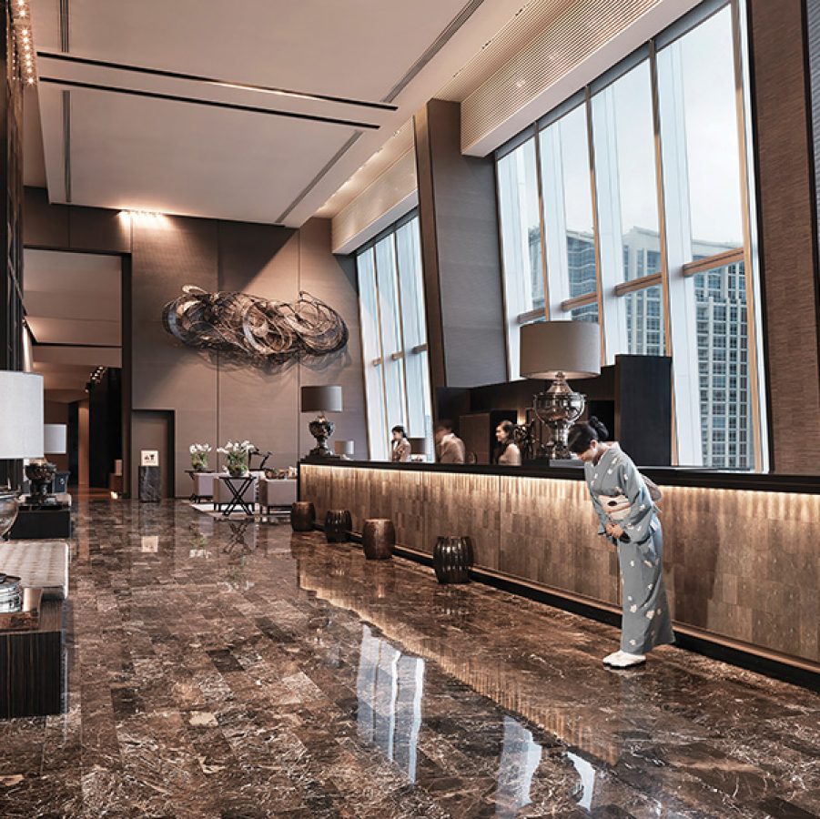 A view of the marbled interiors of the reception and lobby at The Okura Prestige Bangkok