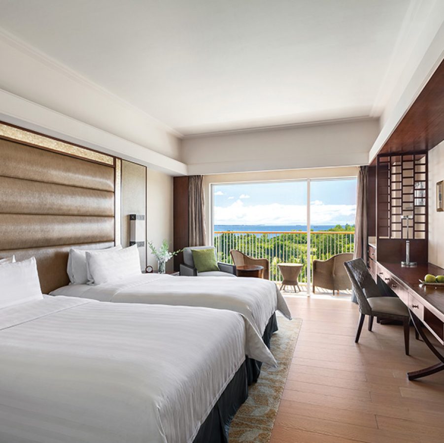 An interior shot of a guest room with two beds at the Shangri-La Mactan hotel in Cebu. 