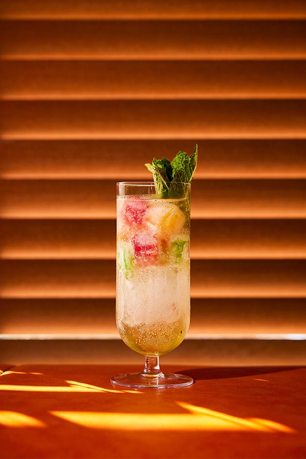 A close-up of Aloha Collins cocktail, served at Dry Wave Cocktail Studio in Bangkok.