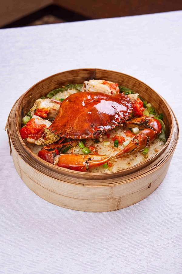 A closeup of a  steamed crab glutinous rice in a steamer basket, served at The Royal Garden Chinese Restaurant in Central.