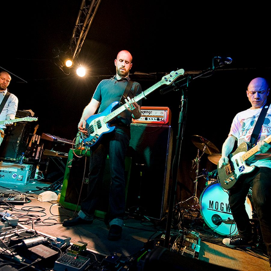 Mogwai performing on stage 