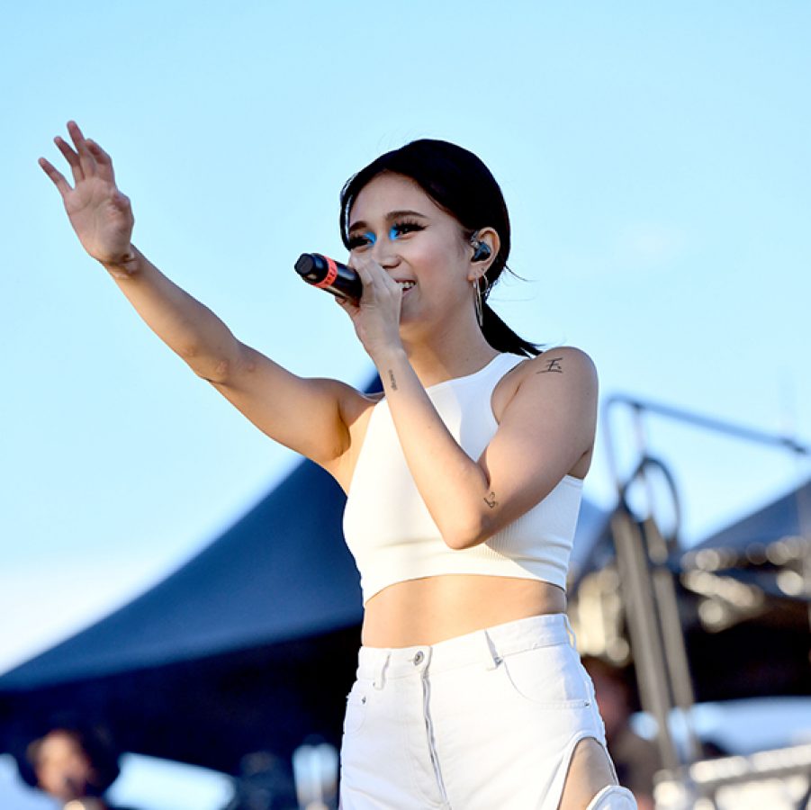 Singer Niki waving to the crowds as she performs 