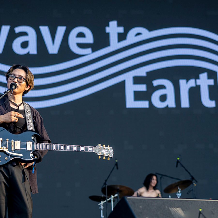 Wave to Earth singing as he performs on stage 