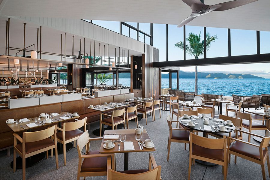 Interior view of a seaside restaurant at Intercontinental Hayman Great Barrier Reef. 