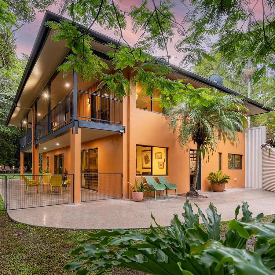 Exterior of Lumholtz Lodge, a guesthouse nestled in a rainforest in the Atherton Tablelands, Australia. 