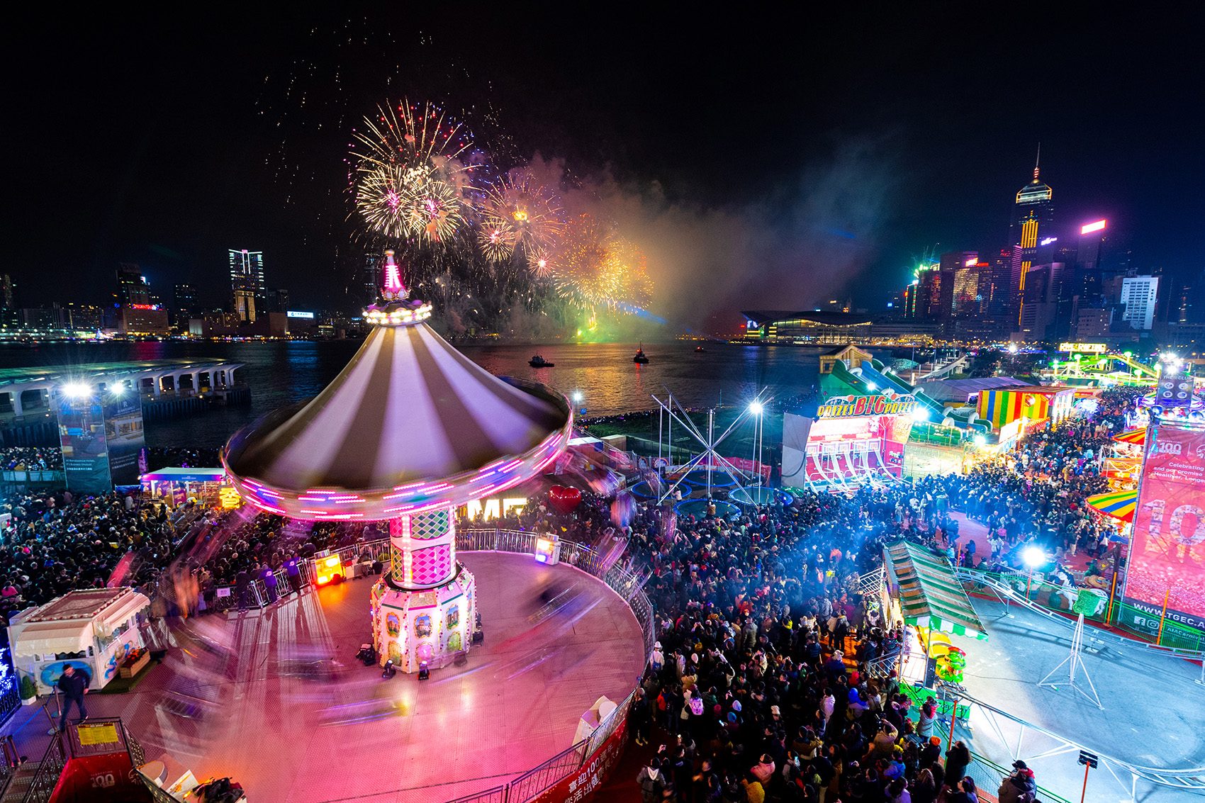 View of fireworks exploding over Hong Kong Harbour and the AIA Carnival.