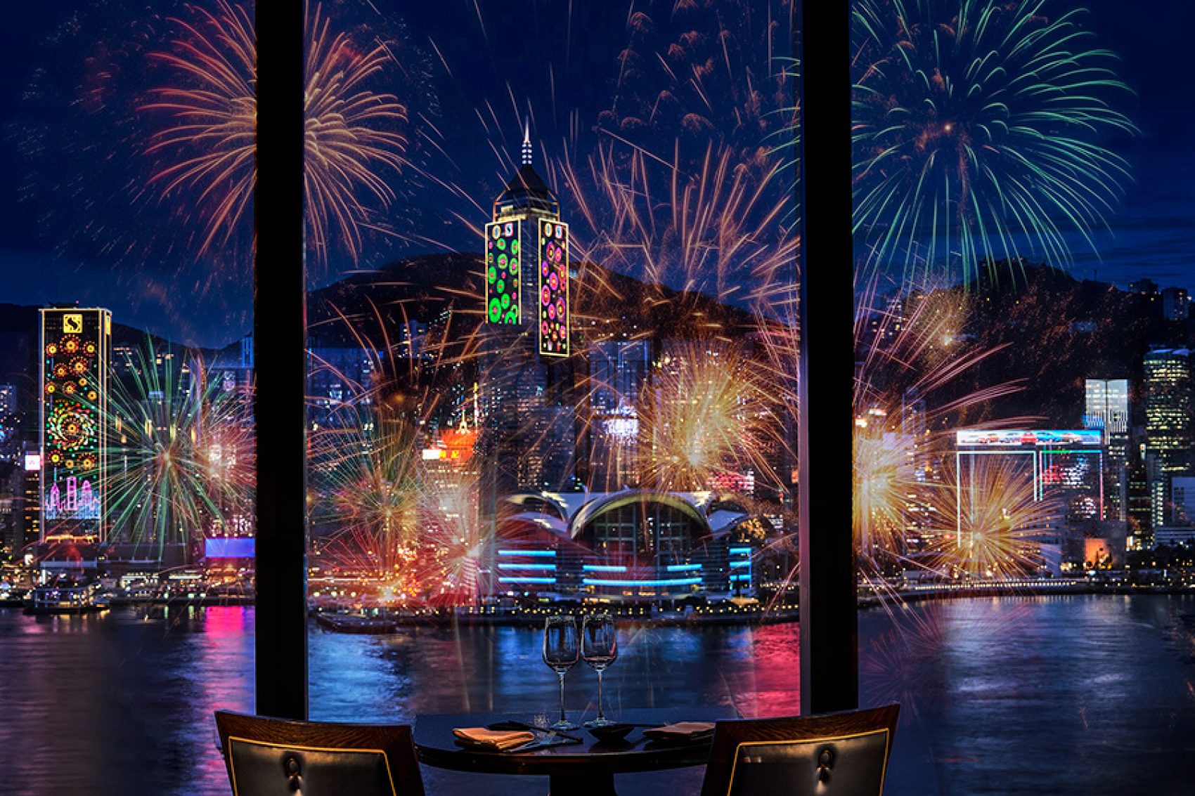 Restaurant dining table with a view of the Hong Kong Harbour fireworks.