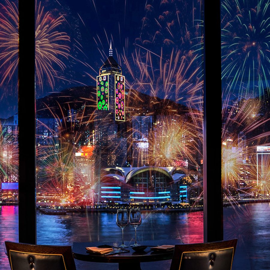 Restaurant dining table with a view of the Hong Kong Harbour fireworks.
