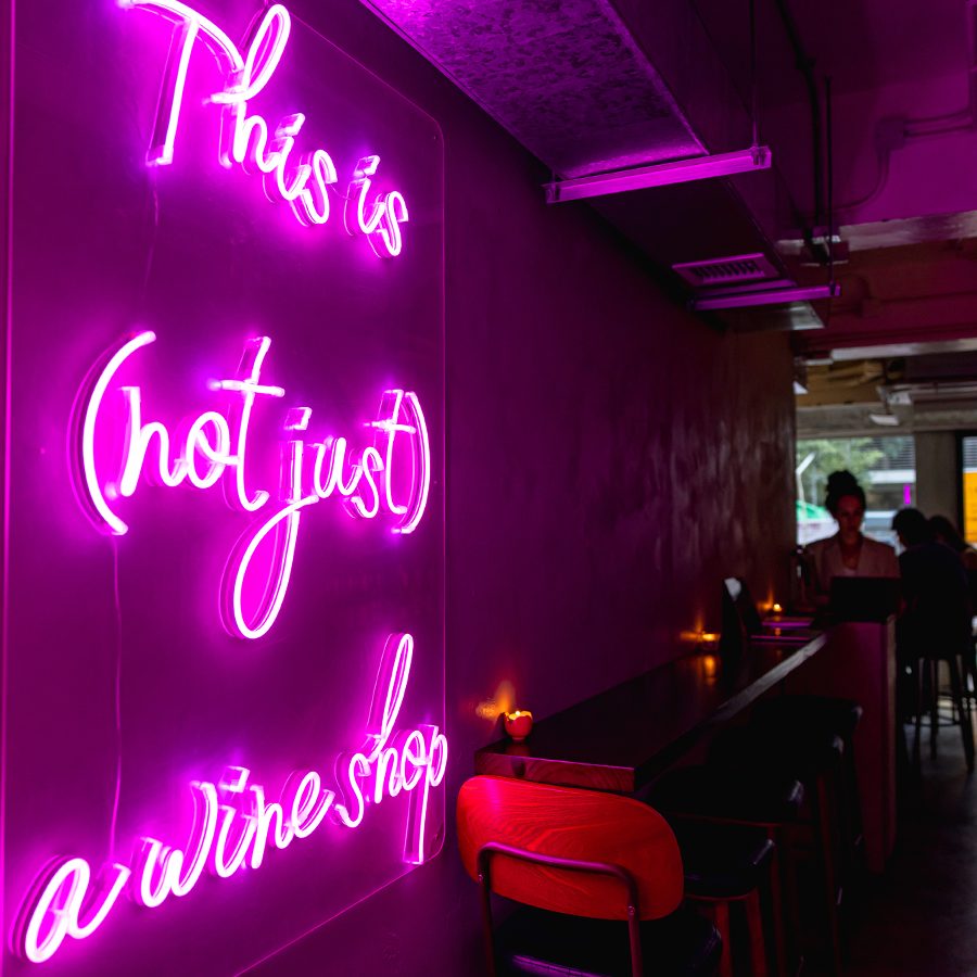 Pink neon sign at wine bar Crushed.