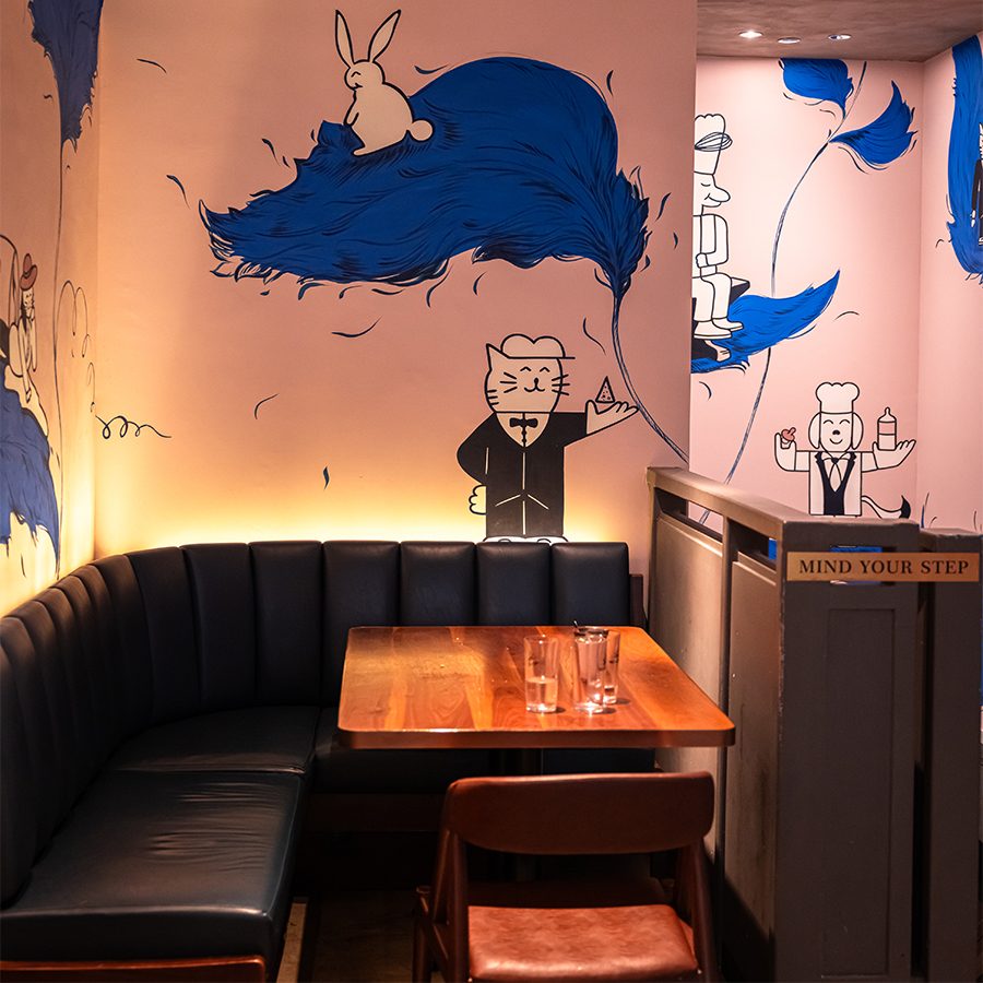 Booth with wall art at The Baker and the Bottleman.