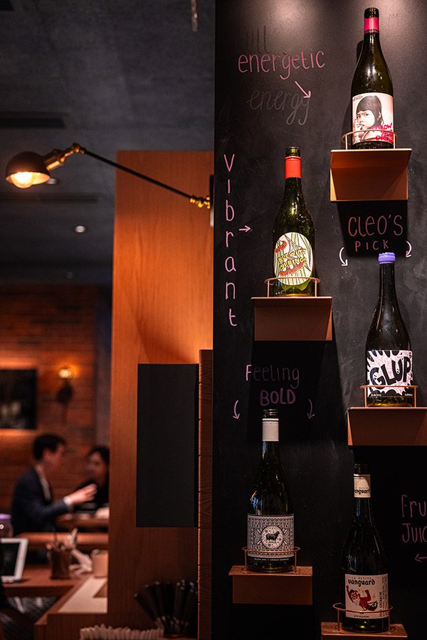 Shot of wine bottles on wall shelves at The Baker and the Bottleman.