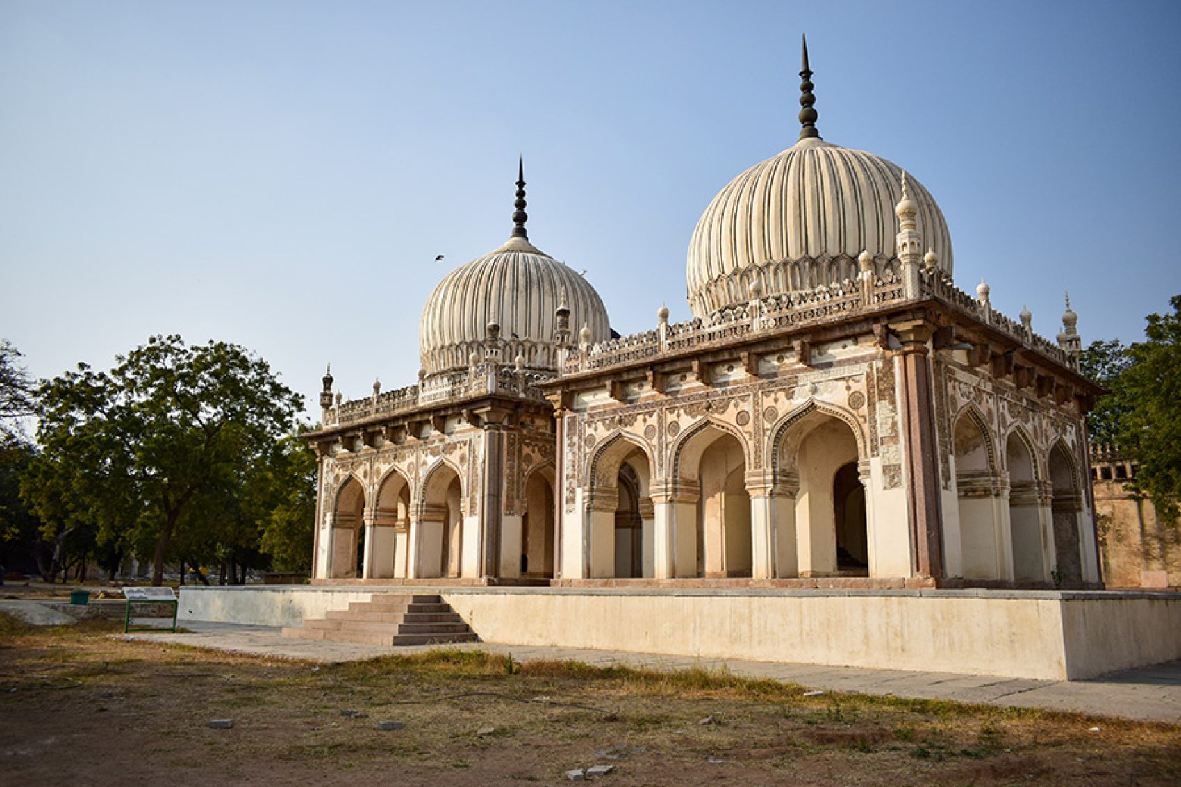 Exterior view of Qutb Shahi Tombs in Hyderabad, featuring its iconic domed crypts.