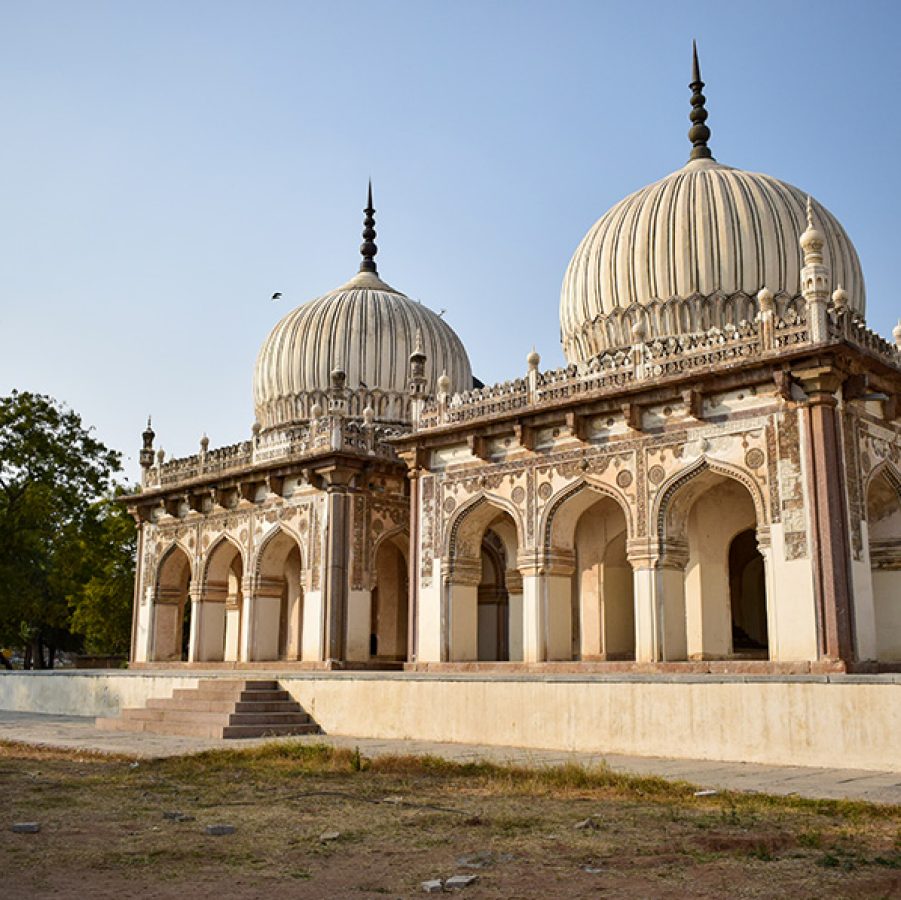 Exterior view of Qutb Shahi Tombs in Hyderabad, featuring its iconic domed crypts.