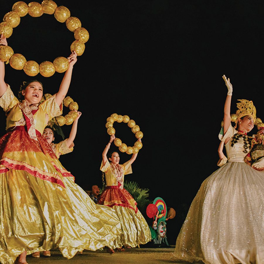  Female performers in long dresses dancing at the Shangri-La Mactan’s Kasadya Night.