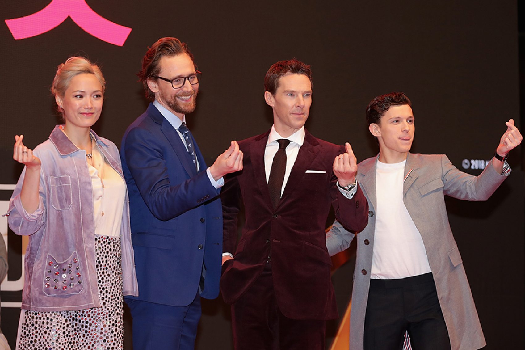 Stars of Marvel films hold up the Korean finger heart symbol.