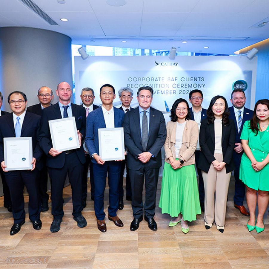A group photo with Cathay’s corporate partners at the Corporate SAF Clients Recognition Ceremony. Some members are holding certificates.