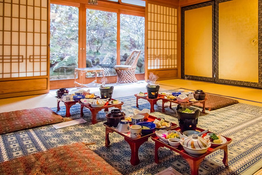 Dining area with food laid out on tables in Ekoin Temple.