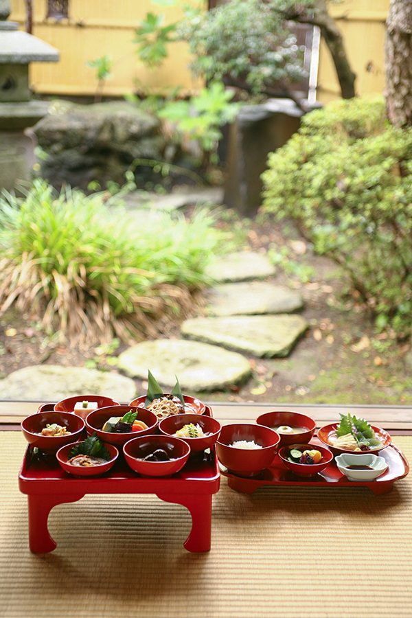 Food laid out on a serving table in Zenkoji Temple.