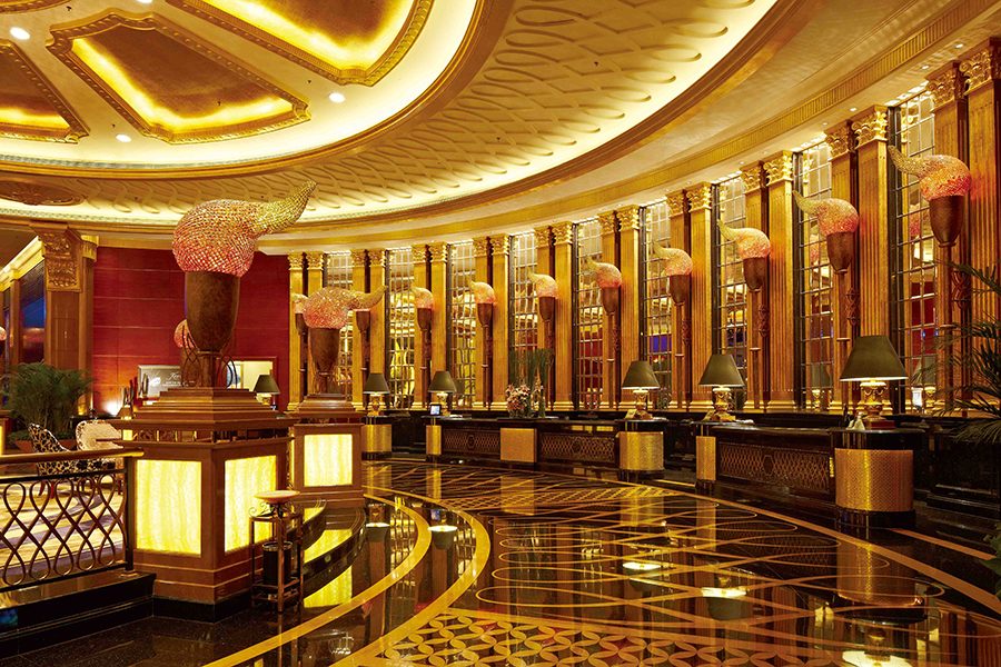 An interior view of the gold lighting, floor tile and decor of lobby at Kempinski Hotel Shenzhen in China.