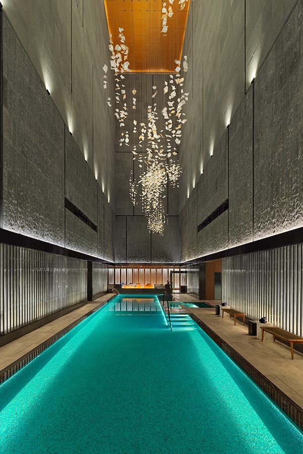 An interior view of the indoor pool and chandelier at Mandarin Oriental Shenzhen hotel in China