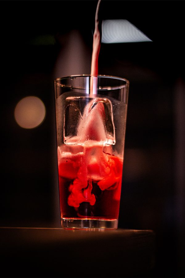 Eclipse, a drink at Baia, is depicted as a glass overflowing with foam.