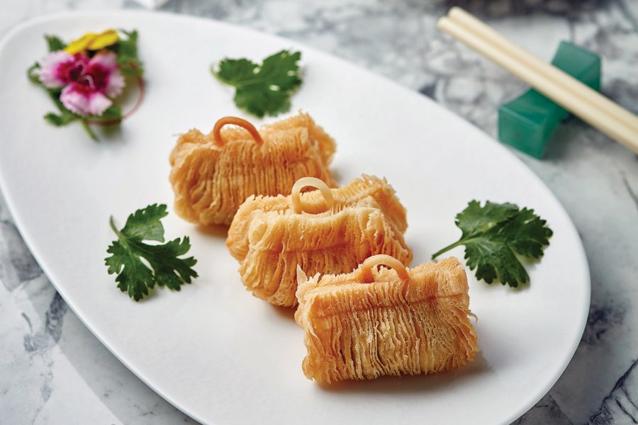 A close-up of three pieces of crispy Australia M9 wagyu beef puff served at Ying Jee Club, Hong Kong.