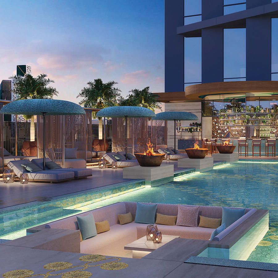 W Riyadh’s outdoor pool is next to comfy lounging chairs and has a wet deck.
