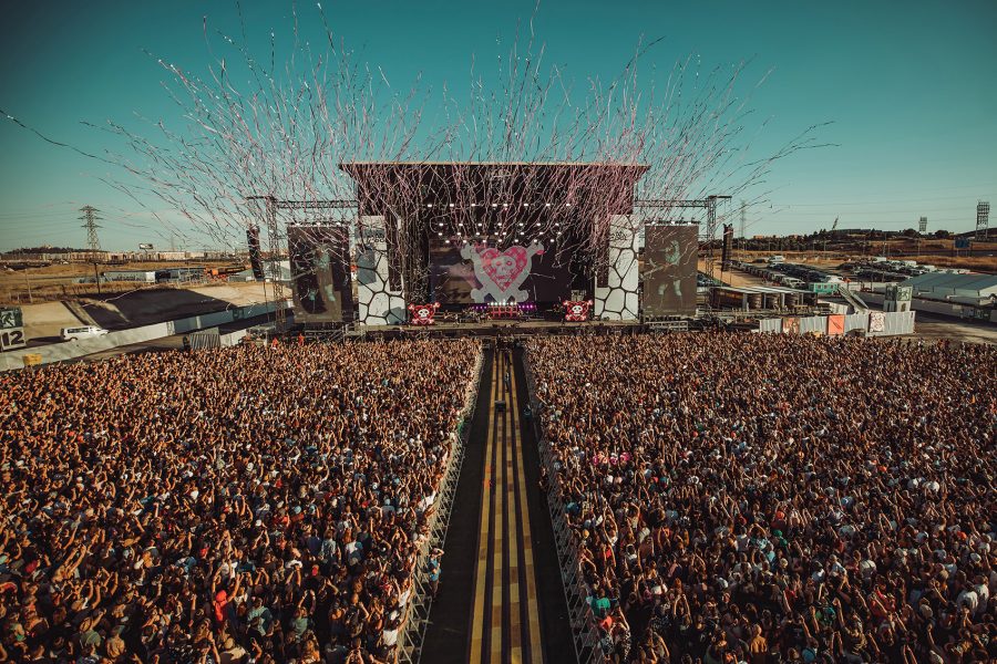 A drone shot of a crowded Mad Cool 2024 music festival outdoors during daytime