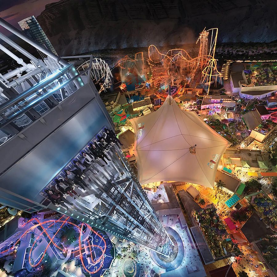 A bird’s eye view of Six Flags Qiddiya City and neon lights in Riyadh in Saudi Arabia at night.