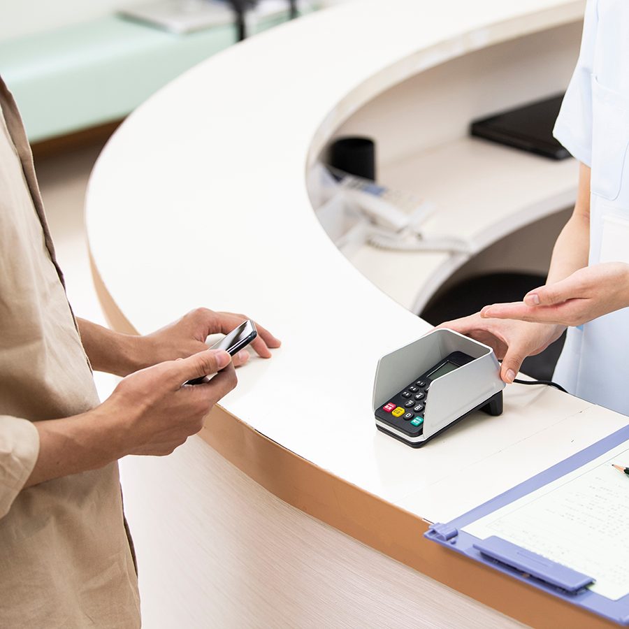A patient registers and pays for medical services at a hospital at the reception, a practice commonly followed in the Chinese Mainland. 