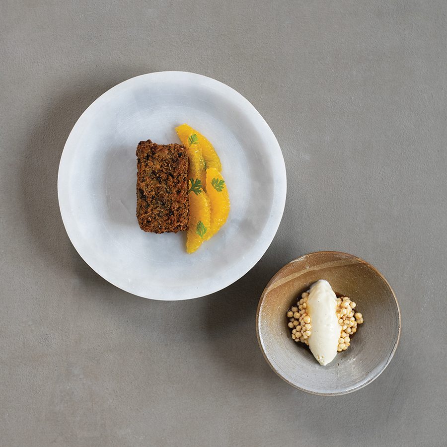 A flatlay view of a dessert and quenelle ice cream served at fine dining Ekka in Mumbai