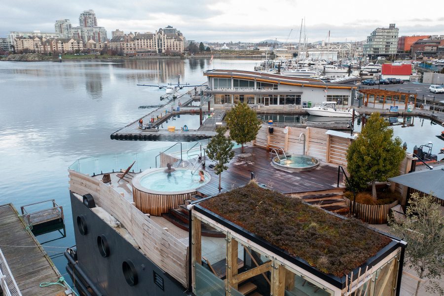 The outdoor tub at Havn, with a view of the Victoria harbour on a cloudy day. 