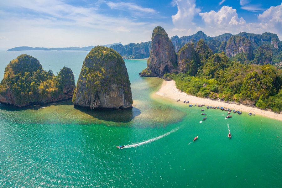 A drone shot of Phi Phi Islands and boats in Phuket on a sunny day