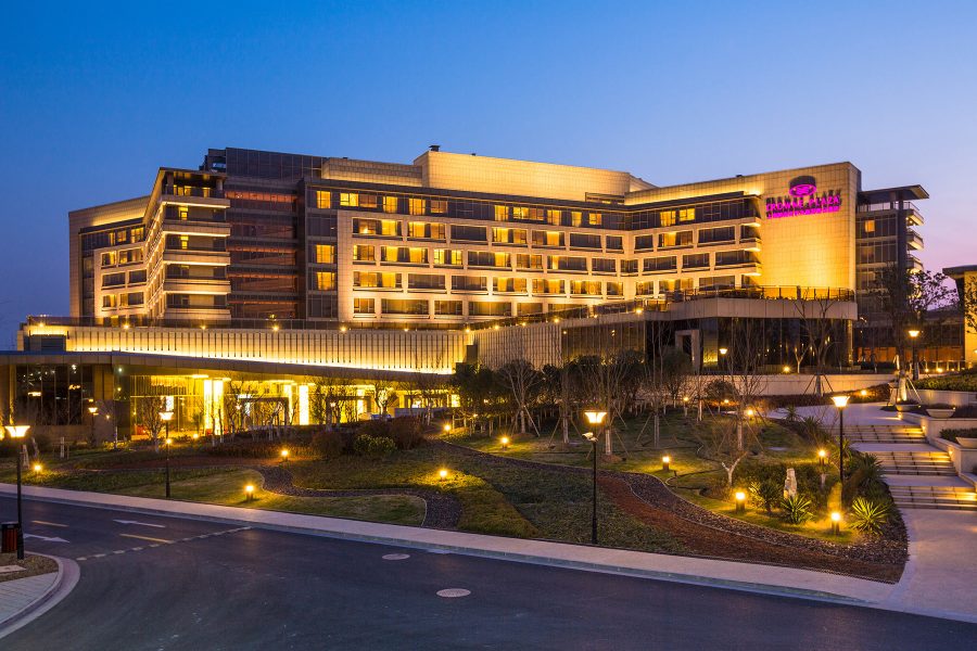 An exterior view of Crowne Plaza Shanghai Anting at night.