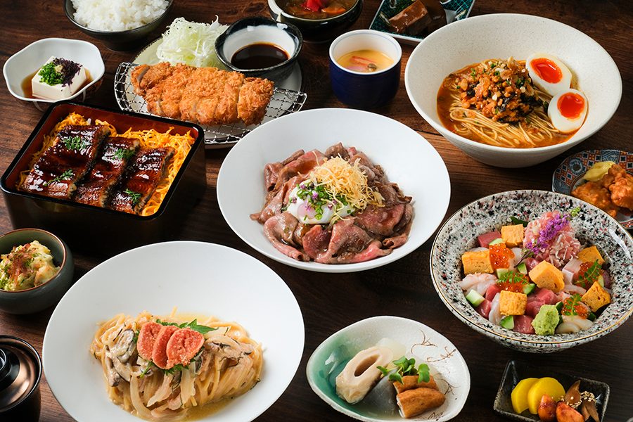 A group shot of various dishes included in the lunch bento set served at Akatsuki Izakaya in Hong Kong.