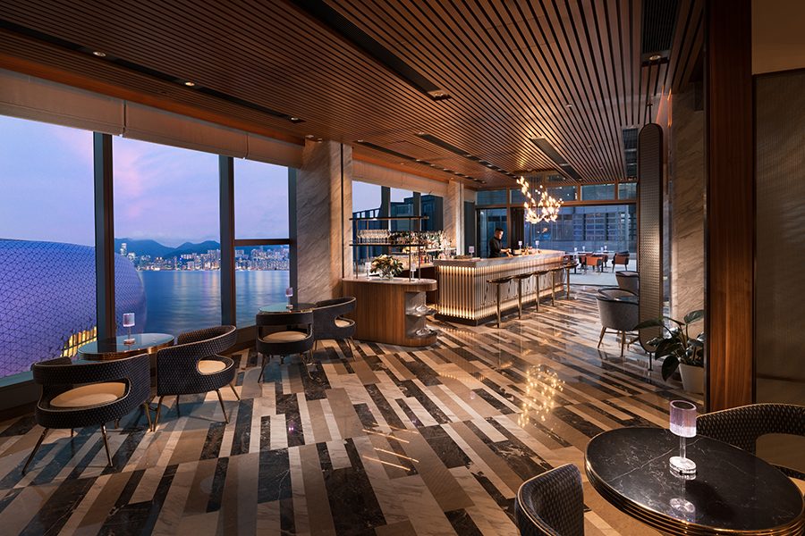 A view of the modern interiors at Jin Bo Law in Hong Kong, featuring floor-to-ceiling windows and panoramic sea views.