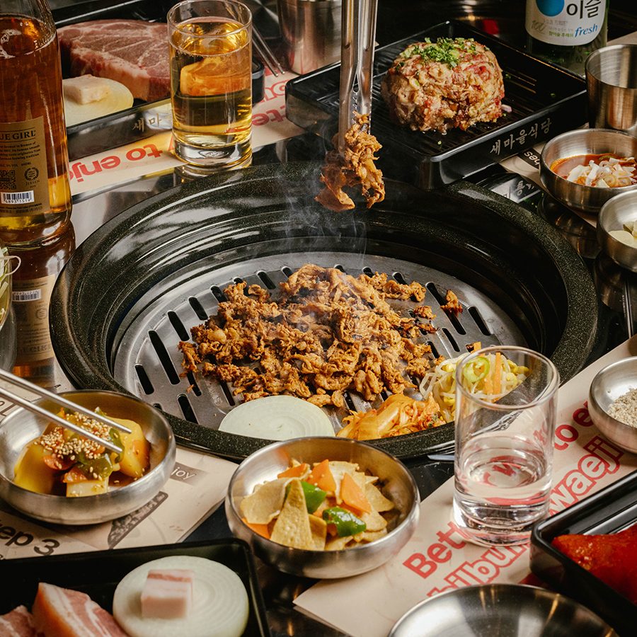 A group shot of various dishes around a barbeque grill, served at Korean restaurant Saemaeul Sikdang in Hong Kong.