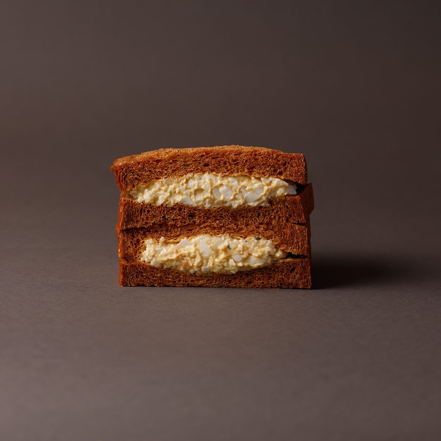 A close-up of a black truffle egg sandwhich, served at Truffle Bakery in Hong Kong.