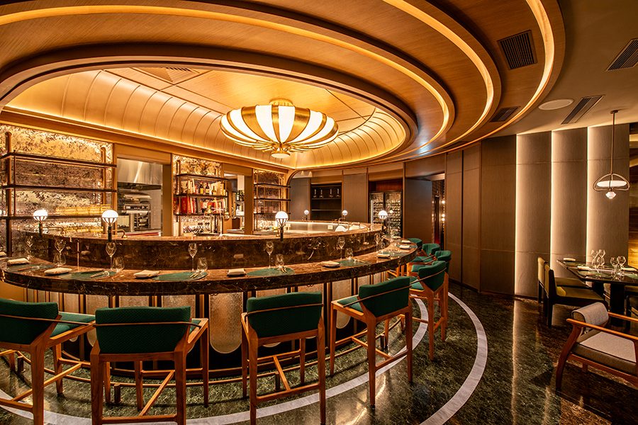 A view of the modern interiors of Té Bo in Hong Kong with warm lighting.