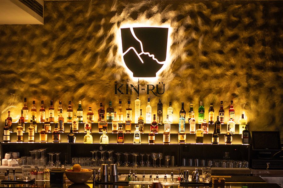 An interior view of the bar and communal table at Bar Kin-Rü in Hyderabad