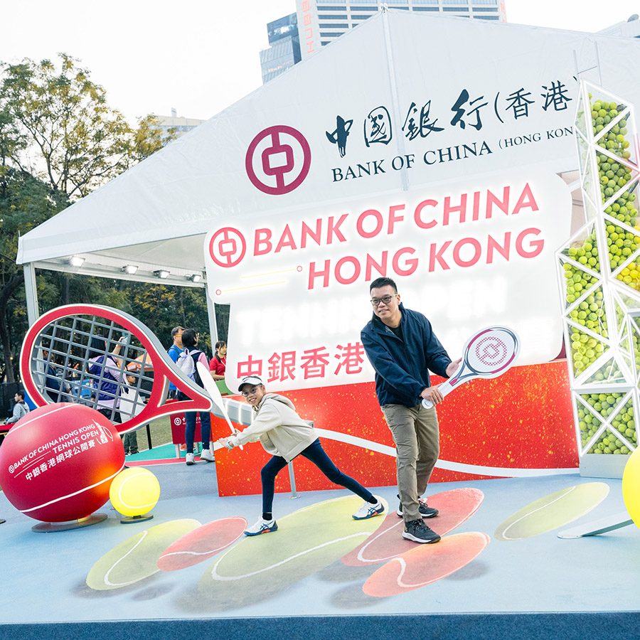 Spectators pose at the China Hong Kong Tennis Open.
