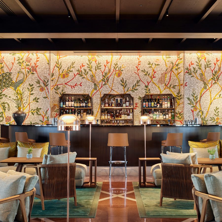 An interior view of the bar and lounge with floral wall panels at Bulgari Hotel Tokyo.