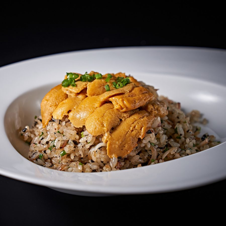 Sea urchin fried rice on a white plate at Stone Sal. 