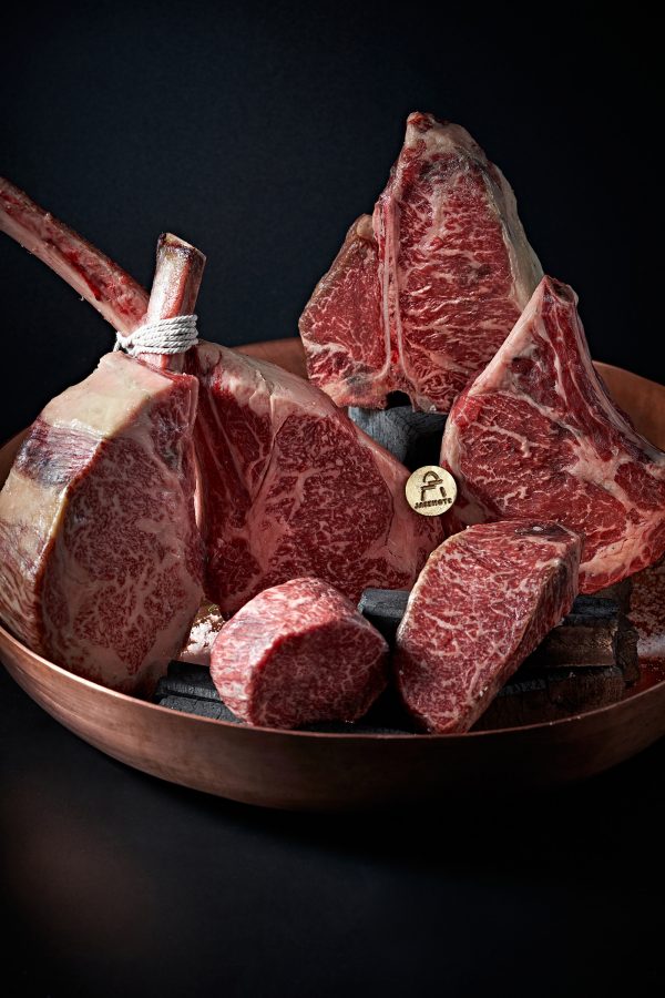 A bowl with different cuts of raw steak at Stone Sal.